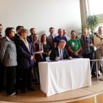 Seattle Mayor Ed Murray signs an open data executive order on Friday at Impact HUB in downtown Seattle.