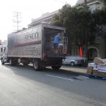 Delivery truck stopped in the right lane to make deliveries