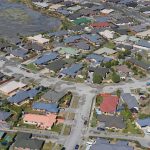 Ariel photo taken above suburban homes.