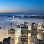 Looking north from downtown Seattle, heavy clouds and fog move in from Puget Sound.