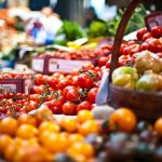 Photo of tomatoes at a market in baskets
