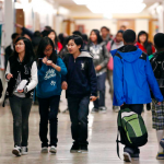 In this photo taken Jan. 11, 2012, students filled the halls at Aki Kurose Middle School in Seattle. Aki Kurose is one of the schools that counts as "intensely segregated," meaning its student population is more than 90 percent non-white.