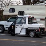 Everett, Washington / USA - 11/16/2018 - Police Parking Enforcement Ticketing vehicle of Boon Docking Homeless Camper