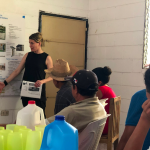 Rachel Berney presenting to local leaders in the community of Ciudad Romero, El Salvador, March 2019.