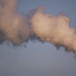 Air pollution smoke rising from plant tower.