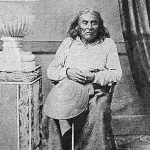 Chief Seattle is seated and facing the camera in a historical photograph.