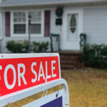 A for sale sign is depicted in front of a suburban home.