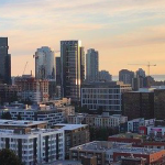 A view of downtown Seattle featuring the skyline and the Spaceneedle over a I-5.