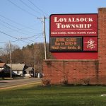 An electronic sign at the entrance to the Loyalsock Township High School and Middle School in Williamsport, PA, USA announces school closures due to COVID-19.