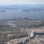Aerial view of West Seattle and the Puget Sound and Olympic Mountains to the west.