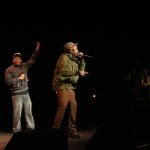 Tilson of The Saturday Knights performing with the Blue Scholars, at the launch of "Seattle, City of Music", Paramount Theater, Seattle, Washington. Left to right: Geologic of the Blue Scholars, Tilson, Sabzi of the Blue Scholars.
