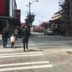 Pedestrians crossing 2nd Ave on Pike St, downtown Seattle.