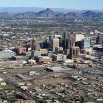 Downtown of Phoenix AZ from an airplane. The mountain in the center is Piestewa Peak.