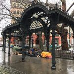 A few tents lining the walkway in Pioneer Square, Seattle during the rainy winter months.