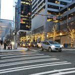 A view of the busy 5th and Columbia crosswalk in downtown Seattle.