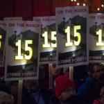 Demonstrators rally to raise the hourly minimum wage for fast-food workers at City Hall in Seattle