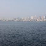 A view of the water and the Seattle skyline with wildfire smoke haze.
