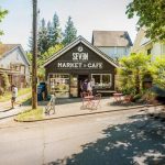 A view of Seven Coffee Roasters Market & Cafe with residential houses in the background.