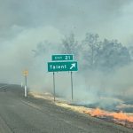 Photograph of highway in Oregon engulfed by wildfire