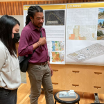 UW Architecture student Miggi Wu discusses her "Bao House" project with Rico Quirindongo, acting director of Seattle's Office of Planning and Community Development in Gould Hall on June 6, 2022.