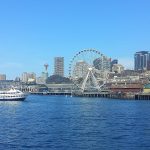 View of the Seattle waterfront and skyline taken from a ferry.