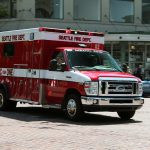 Seattle Fire Department Medic One Ambulance driving down a street in downtown Seattle