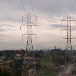 Image of power lines above horizon with grey sky in Seattle.