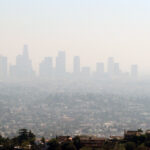 City skyline with smog-filled skies