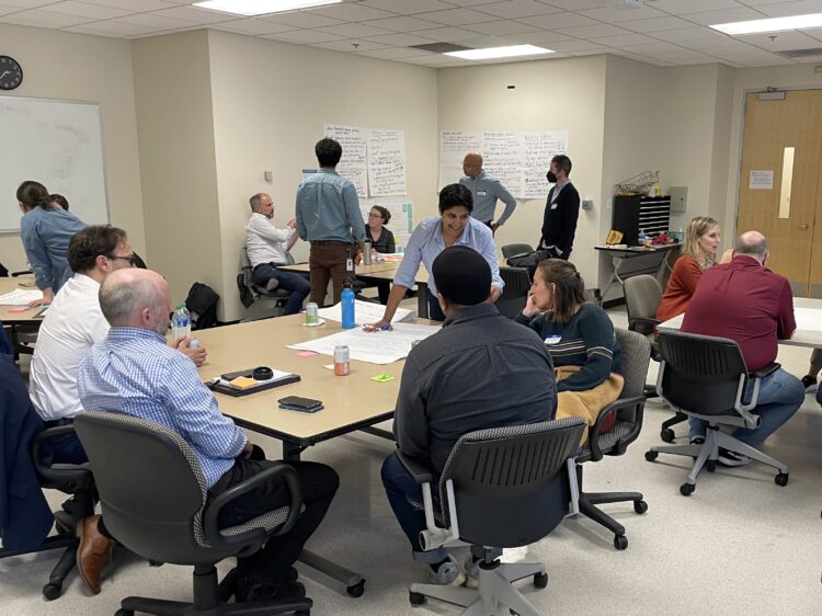 groups of people sitting around tables.